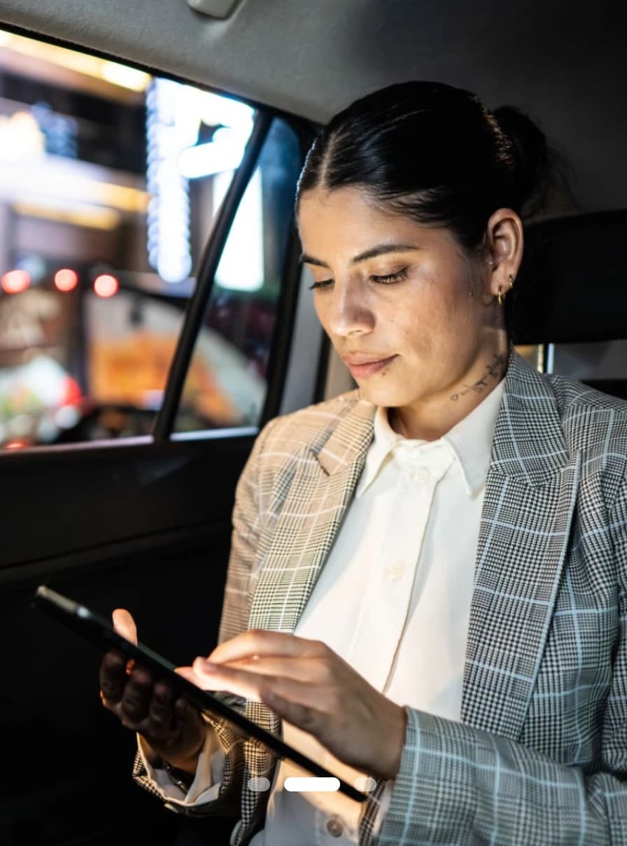 A clinician reading a drtalk channel post on a tablet between appointments