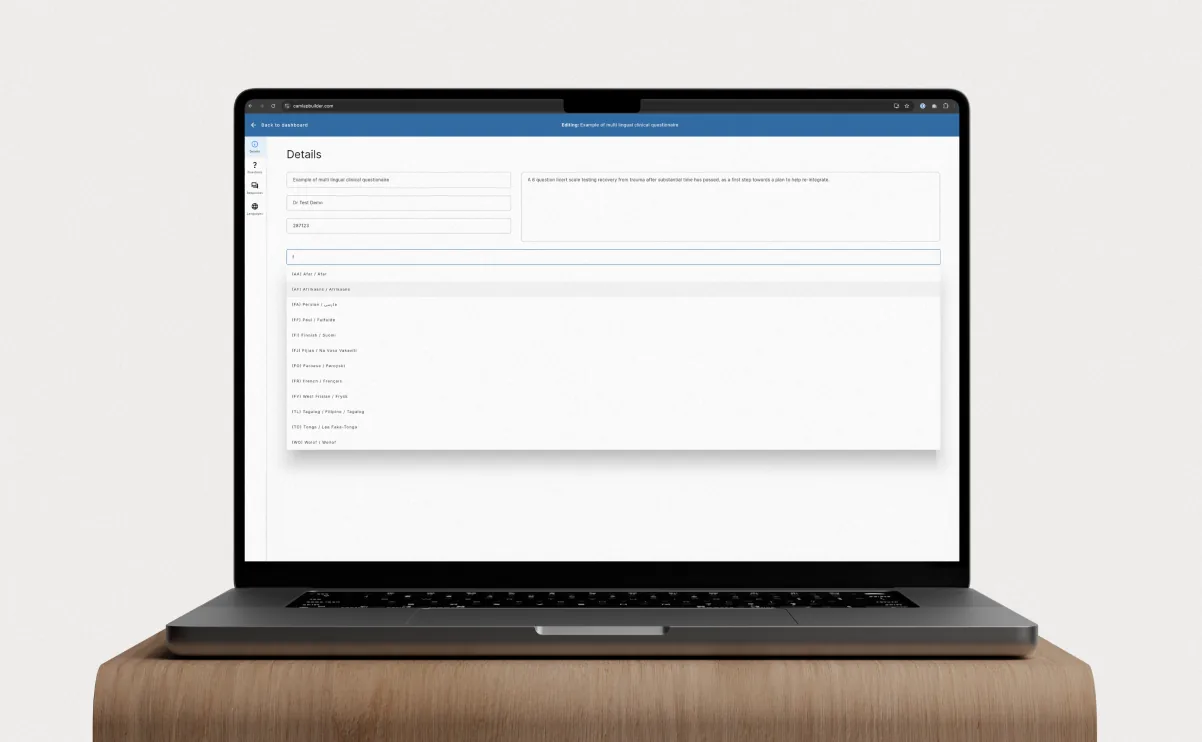 A laptop on a plinth showing the CAMLAP Builder questionnaire editor